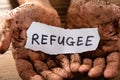 Man With Piece Of Paper Showing Refugee Word