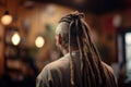 man& x27;s dreadlocks hair haircut back view on blurred background Royalty Free Stock Photo