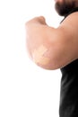 ManÃÂ´s elbow glued medical plaster, isolated on white, concept f Royalty Free Stock Photo