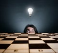 Man's face and burning light bulb. Royalty Free Stock Photo