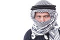 Man's face covered with Arab scarf