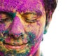 Man's face covered with powder paint during Holi festival