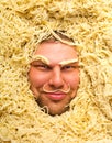 Man's face in pasta, closeup