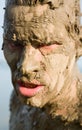 Man's face is very dirty in the mud Royalty Free Stock Photo
