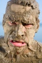 Man's face is very dirty in the mud Royalty Free Stock Photo