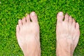 Man`s feet standing on grass Royalty Free Stock Photo