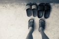 Man`s feet Wear sandals and choose slippers Royalty Free Stock Photo