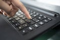 Man`s finger finger press enter button. closeup of male hand typing on keyboard Royalty Free Stock Photo