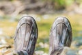 Man s foot in rubber boots. Rubber boots of the fisherman Royalty Free Stock Photo