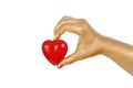 Man's golden hand with a red heart Royalty Free Stock Photo