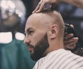 Man`s haircut, a hairdresser cuts his hair Royalty Free Stock Photo