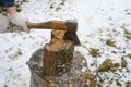 Man`s hand with an axe chopping wood Royalty Free Stock Photo