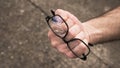 man's hand clenched into a fist with broken glasses Royalty Free Stock Photo