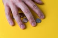 The man`s hand covered the coins. Protecting your money. Lack of money Royalty Free Stock Photo