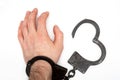 Handcuffed hand isolated on white background Royalty Free Stock Photo