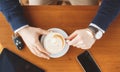 A man's hand,a Cup of coffee,tablet and car keys Royalty Free Stock Photo