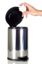 Man's Hand disposing of trash in stainless steel trash can Royalty Free Stock Photo