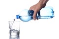 Man`s hand fill a water glass with a plastic bottle, clipping path included Royalty Free Stock Photo