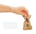 Man's hand gives the bag with dollars Royalty Free Stock Photo