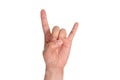 A man`s hand giving the Rock and Roll sign. Royalty Free Stock Photo