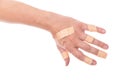 ManÃÂ´s hand glued a lot of medical plaster on the elbow, isolate Royalty Free Stock Photo