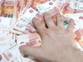 Man`s hand grabs cash, Russian five thousand ruble banknotes