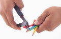 Man's hand hold cutter to strip electrical wire Royalty Free Stock Photo