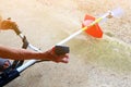 Man`s hand is hold and press button To make the cutting blade of Lawn mower is work Royalty Free Stock Photo