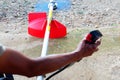 Man`s hand is hold and press button To make the cutting blade of Lawn mower is work Royalty Free Stock Photo