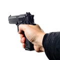 Man`s hand holding a black pistol gun, isolated on white, close- Royalty Free Stock Photo