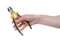 Man`s hand holding a black and yellow wire cutter. Open, clean, ready to cut form Royalty Free Stock Photo