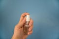 Man`s hand holding a bottle of antiseptic spray for desinfection Royalty Free Stock Photo