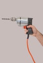 Man's hand holding a drill Royalty Free Stock Photo