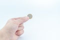 Man`s hand holding euro coin. Finance concept Royalty Free Stock Photo