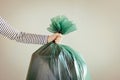 Man`s hand holding garbage bag. Royalty Free Stock Photo