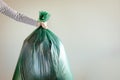 Man`s hand holding garbage bag. Royalty Free Stock Photo