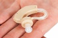 Man's Hand Holding Hearing Aid Device Royalty Free Stock Photo