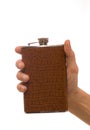 Man's hand holding hipflask