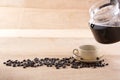 Coffee and pour into a cup decorated with roasted coffee beans on Royalty Free Stock Photo