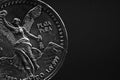 Man's hand holding a silver American coin, close-up of a quarter dollar coin isolated over black. Bag, dollars Royalty Free Stock Photo