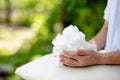 Man`s hand holding White Polyester fiber