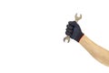 Man`s hand holding wrench on a white background, isolate, with clipping path. Man`s hand in gloves Royalty Free Stock Photo