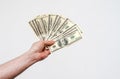 Man hand holds american dollars money. On black background. Finance, earnings, crediting