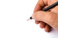 Man`s hand holds a black pencil against white background, select Royalty Free Stock Photo