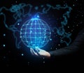 A man`s hand holds a holographic globe on a dark blue background. Concept of globalization, world internet network, barrier-free