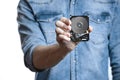 Man`s hand holds a 2.5 inch hard drive. Isolated on white background. Royalty Free Stock Photo