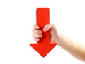 A man`s hand holds a large red arrow. Close up. Isolated on a wh Royalty Free Stock Photo