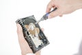 Man`s hand holds open 3.5 HDD.