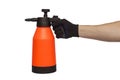 A man`s hand holds hand-pumped sprayer isolated on white background. Garden pressure sprayer for dispensing fertilizer, pesticide