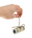 Man's hand holds a roll of banknotes of dollars isolated on white background Royalty Free Stock Photo